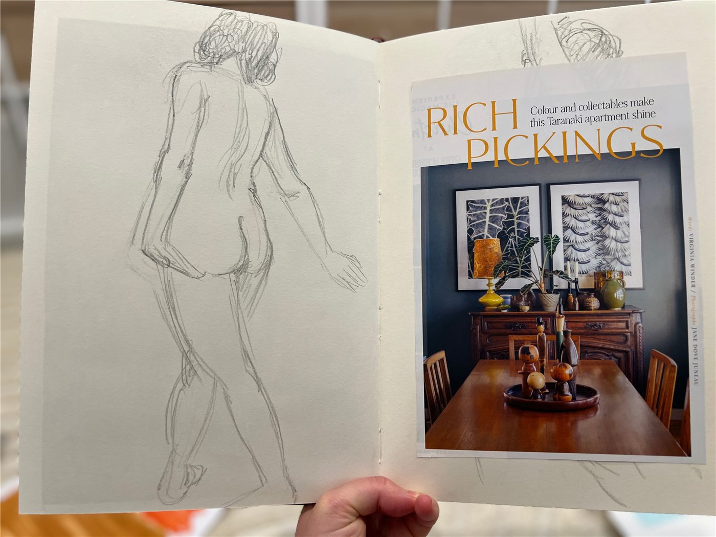 Magazine clippings glued over old drawings in a recycled sketchbook